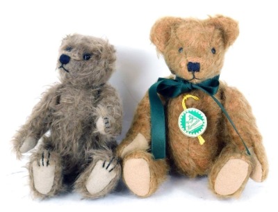 Two small Teddy bears, comprising a Herman German bear with green bow, seated, 11cm high, and a Deans Rag bear, 10cm high. (2)