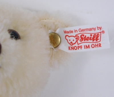 A Steiff exhibition bear, the white bear holding a coloured football, with label to ear, 21cm high, boxed. - 2