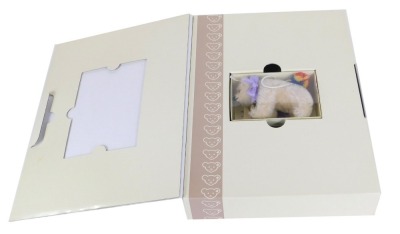 A Steiff Club polar bear, with bell and ball, 11cm wide, in presentation box.