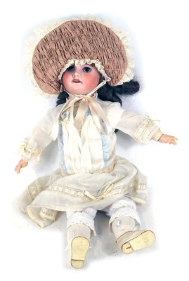 A French bisque headed doll, stamped SFBJ, no. 60, Paris, with closing eyes and articulated limbs, 50cm high.