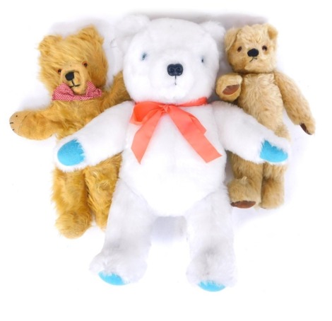 Three teddy bears, comprising a blonde plush jointed mohair teddy bear, a teddy bear with articulated limbs, and a white teddy bear. (3)