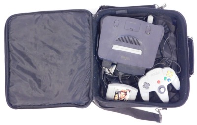 A Nintendo 64 games console, with single controller, and selection of games to include Golden Eye 007 Mission Impossible, Banjo Kazooi, Super Mario 64, Raymond II The Great Escapes, Yoshi's Story, Blast Corps, and Hardball, all in a Nintendo 64 carry case - 3