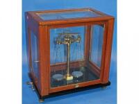 A Baird & Tatlock London Ltd chemical balance in mahogany case with black marble base