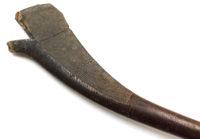 A 19thC Fijian Kiakavo gunstock war club, of dense hardwood, the flattened edge carved with cross hatching interspersed with bands of chevrons, on a curved shaft terminating in a flared grip, 114cm wide. (AF) - 3