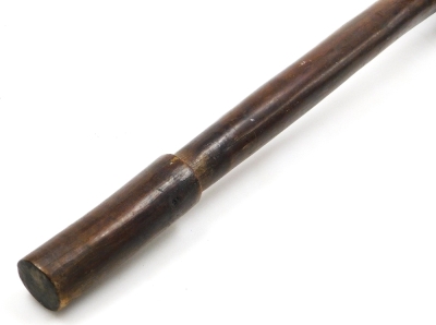 A 19thC New Caledonian Melanesia Kanak war club, of dense hardwood with a mushroom shaped phallic head, and a tapering cylindrical shaft, terminating in an expanded flange grip, 70cm wide. (AF) - 7