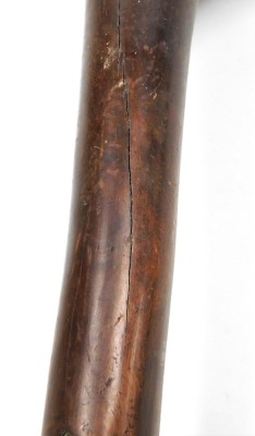 A 19thC New Caledonian Melanesia Kanak war club, of dense hardwood with a mushroom shaped phallic head, and a tapering cylindrical shaft, terminating in an expanded flange grip, 70cm wide. (AF) - 9