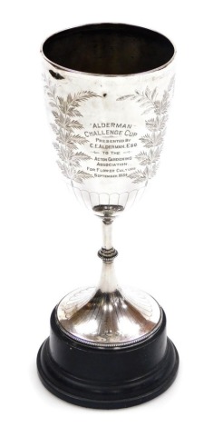 A Victorian silver trophy, with bright cut and chased decoration, presentation engraved 'Alderman Challenge Cup, presented by C.E. Alderman Esq. to the Acton Gardening Association for flower culture, September 1934,' bearing various names and dates of win