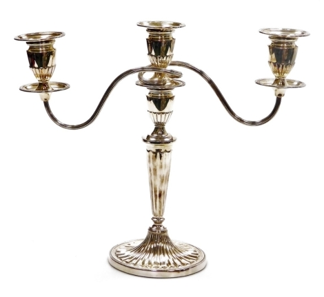 An Elizabeth II silver candelabrum, with part fluted decoration and beaded borders, C.J. Vander Ltd., Sheffield 1993, loaded, 37cm high.