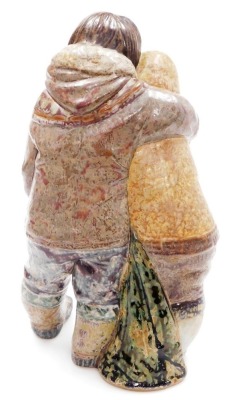 A Lladro porcelain figure group of an Inuit boy and girl, modelled standing in embrace, printed marks, 38cm high. - 2