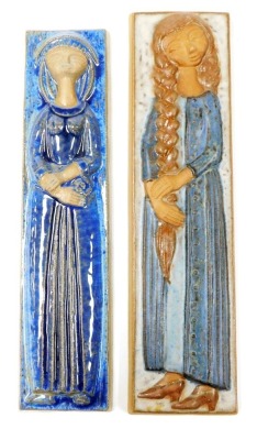 Two Danish stoneware wall plaques by Marianne Starck for David Andersen, each depicting a female, one plaiting hair, number 6056, 39cm x 10cm, and another with arms crossed, number 5813, 36.5cm x 8.5cm.