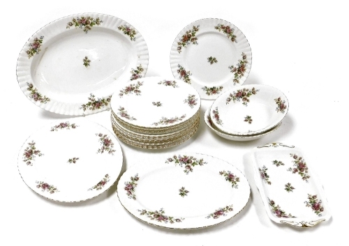 A group of Royal Albert porcelain Moss Rose pattern dinner wares, comprising three graduated meat platters, twelve dinner plates, pair of oval serving dishes, and a sandwich plate.