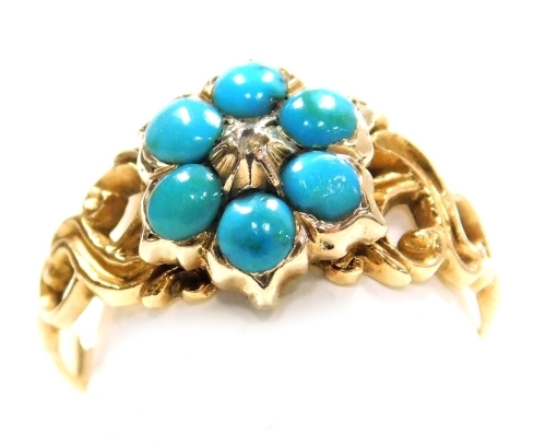 A Victorian turquoise and old cut diamond flower head ring, set in a scrolling yellow metal shank, size I/J, 2.4g.