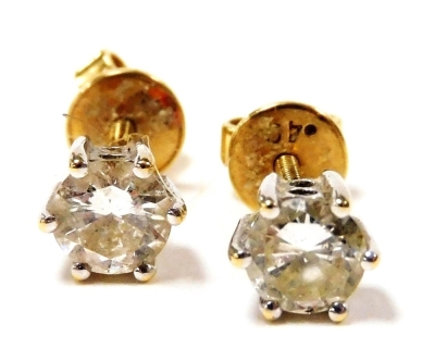 A pair of 18ct gold and diamond ear studs, high claw set, each approx 0.5cts, 2.1g.