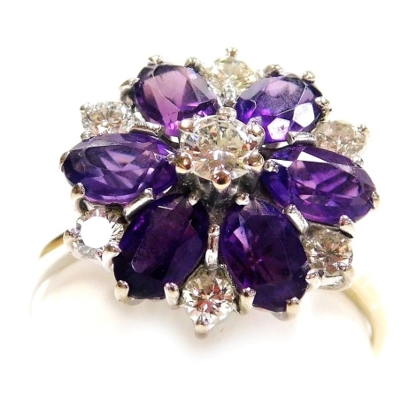 An amethyst and diamond flower head ring, high claw set in white metal, diamonds approx 0.5ct, size T, 5.2g.