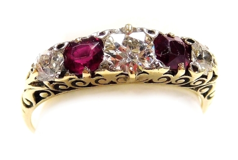 A ruby and diamond five stone ring, set in yellow metal, diamonds approx 0.75ct, size O/P, 3.5g.