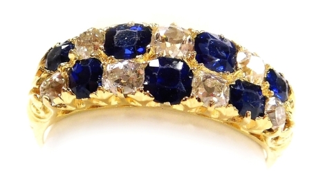 A sapphire and diamond two row ring, each stone set at intervals, in yellow metal, diamonds approx 0.5ct, size Q, 4.3g.