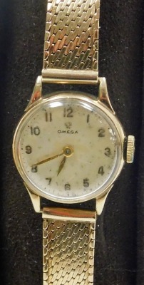 An Omega lady's 9ct gold cased wristwatch, circular champagne dial bearing Arabic numerals, back plate monogram engraved and dated 1953 on a 9ct gold mesh strap, cased and outer boxed, 21.2g all in. - 2