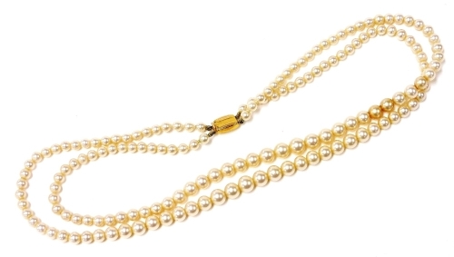 A Ciro two strand simulated graduated pearl necklace, on a 9ct gold clasp.