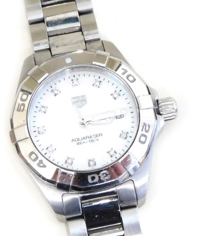 A Tag Heuer Aquaracer lady's stainless steel cased wristwatch, circular opalescent dial set with diamonds, centre seconds, WBD1414/WAU9917, on a bracelet strap, boxed and outer boxed.