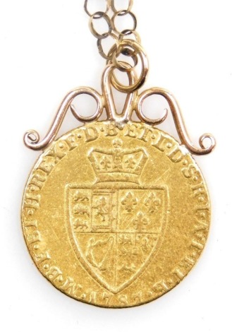 A George III spade guinea 1787, with a pendant mount, on a 9ct gold belcher link neck chain, with bolt ring clasp, 12.9g all in.