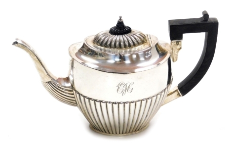 An Edward VII silver teapot, of part fluted form, initial engraved, John Millward Banks, Chester 1901, 17.71oz all in, 19cm high.