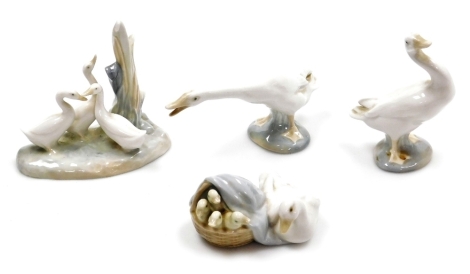 A group of Lladro, comprising two geese, 12cm and 7cm high, a duck and ducklings group, 10cm wide, together with a Nao porcelain group of geese beside a plant, 11cm high.