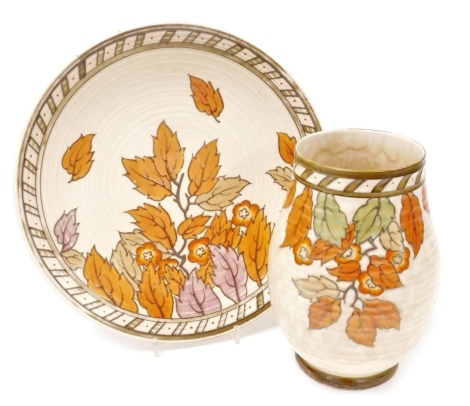 Two items of Crown Ducal Charlotte Rhead Golden Leaves pattern pottery, comprising a charger, no. 4921, 32cm diameter, and a vase of baluster form, 22cm high.