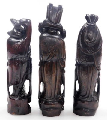 Three Chinese carved hardwood figures of the Sanxing deities, with silver wirework inlay, comprising Shou God of Longevity, 29cm high, Lu God of Prosperity, 33cm high, and Fu God of Fortune, 30cm high. - 3