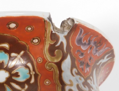 A Japanese Meiji period pottery vase, of cylindrical form with a flared rim, decorated with a reserve to front and verso of a three clawed dragon in clouds, further reserves of birds, trees, etc., on a red ground, 59cm high. (AF) - 7