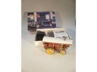 A minicraft model kit of a 1933 Cadillac V16 town car and a made up kit