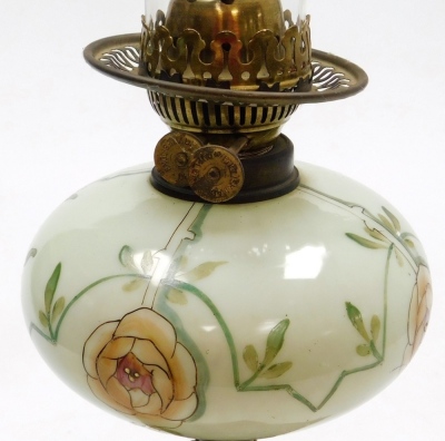 A late 19th Duplex oil lamp, with an opaque floral decorated central reservoir, on a pierced floral decorated cast iron base, lacking shade, 57cm high. - 2