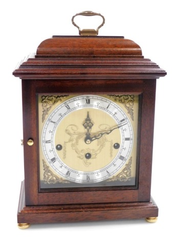 A 20thC mahogany cased mantel clock, the brass dial bearing Roman numerals, silvered chapter ring, eight day Franz Hermle movement, Westminster chime, the case 27cm high.