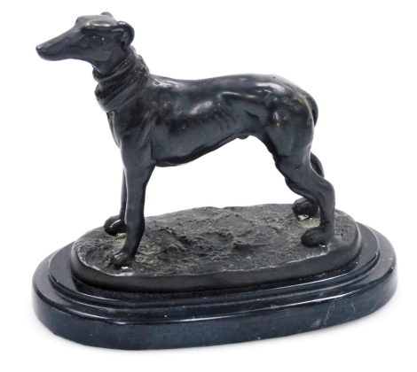 A 20thC bronze sculpture, modelled as a Whippet standing on a naturalistic base, raised on a stepped marble base, unsigned, 16cm high.