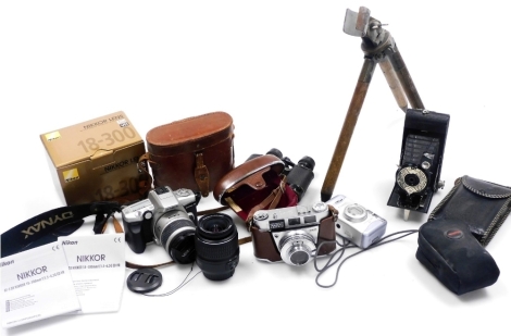 A group of cameras and related equipment, to include a Minolta Dynax 4 camera, a Kodak Retinette IB camera, in leather case, a pair of field binoculars in leather case, etc. (1 tray)