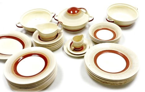 A Susie Cooper part dinner and tea service, decorated in bands of cream, grey, coral, and red, comprising three tureens, one with cover, gravy boat, oval meat plat, four breakfast bowls, eleven side plates, milk jug and saucer, six dinner plates, twelve f