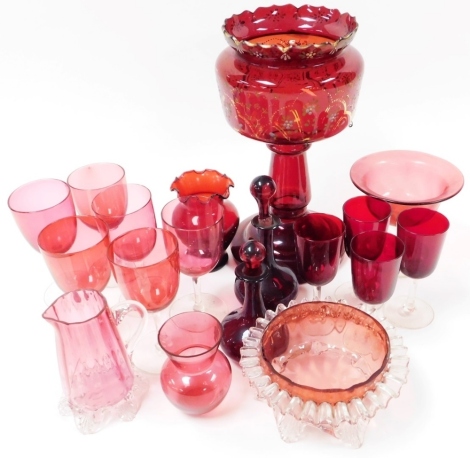 A group of Victorian and later cranberry coloured glass, to include drinking glasses, jug 11.5cm high, lustre with painted floral decoration and gilt highlights, lacking lustres, 26cm high, etc. (1 tray)