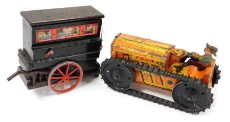 An American Marx Toys tin plate wind up tractor, painted orange and yellow, with removable figure, and rubber tracks, 21cm wide, and a Tallert Of Old Bond Street tureen musical caravan, 15cm high.