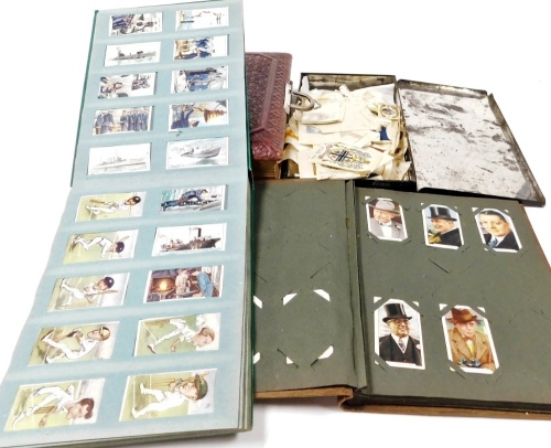 Cartophily - two albums containing cigarette cards, etc., to include Gallagher sports personalities, Wills, a leather bound photograph album, lacking contents, silk cigarette cards, etc.