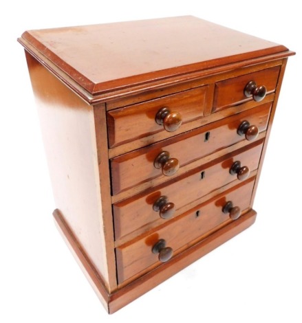 A Victorian mahogany apprentice chest, the top with a moulded cornice, above two short over three long drawers, on a plinth base, 41cm high, 36cm wide, 24cm deep.