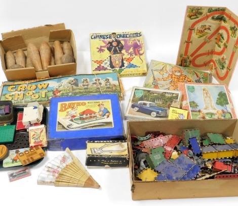 A group of mid century children's toys and games, to include a Bako Building Set 1, boxed, Meccano, Grow Shoot, puzzles, cards, wooden skittles, etc. (a quantity)