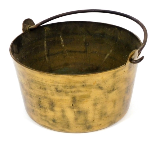 A Victorian brass preserve pan, with a wrought metal handle, 36cm diameter.