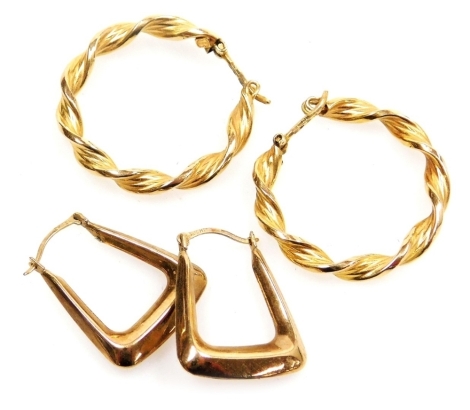 A pair of 9ct gold twist hoop earrings, together with a pair of 9ct gold stirrup shaped earrings, 3.2g.