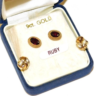 A pair of 9ct gold knot earrings, 0.7g, together with a pair of 9ct gold and ruby earrings.