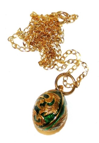 A 9ct gold and enamel egg shaped pendant, on a curb link neck chain, with bolt ring clasp, 5.0g all in.