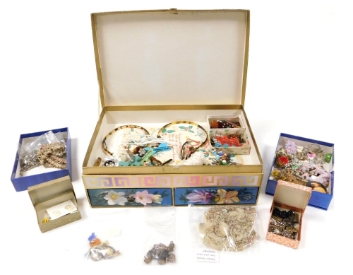 A group of early 20thC costume jewellery, including paste set buckles, hair slides, brooches, together with buttons, costume trimmings, silver charms, etc. (2 boxes)