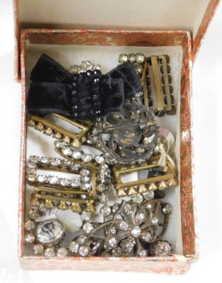 A group of early 20thC costume jewellery, including paste set buckles, hair slides, brooches, together with buttons, costume trimmings, silver charms, etc. (2 boxes) - 7