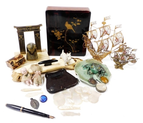 A group of collectables, to include a pair of La Mignonne stereoscopic binoculars, in outer leather case, mother of pearl counters, studio pottery figure of a frog on a lily pad, 14cm wide, an Oriental lacquer box, and an early 20thC brass and marble desk