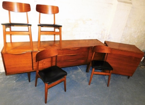 A 1960's teak sideboard, the base with three drawers, flanked by a drop cupboard, the other side with two further cupboards, on tapering legs, 72cm high, 203cm wide, 40cm deep, together with a teak drop leaf table, 76cm high, 77cm wide, and four matching 