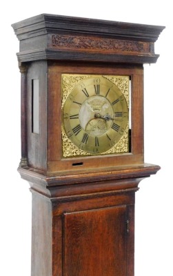 A Georgian oak cased long case clock, by J N Stokes of St Ives, number 667, the brass dial bearing Roman and Arabic numerals, subsidiary seconds dial, with cherub and scroll spandrels, chain driven, the case with scroll carving to the top, on a plinth bas - 2