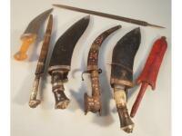 Two Kukri knives, an Eastern Jambiya, two Eastern daggers etc